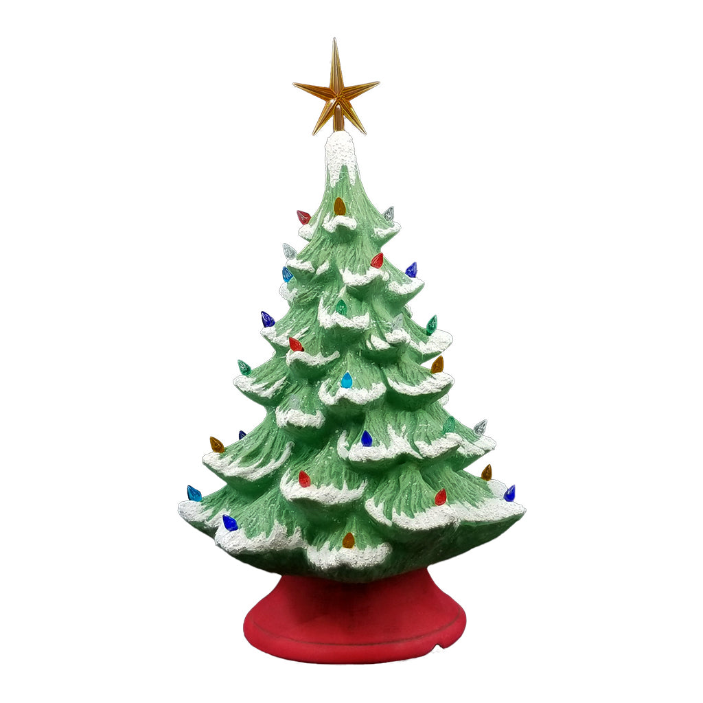A vintage-style ceramic Christmas tree with a textured green body, white snow-dusted layers, multicolored light bulbs, a gold star topper, and a red base, isolated on a white background.