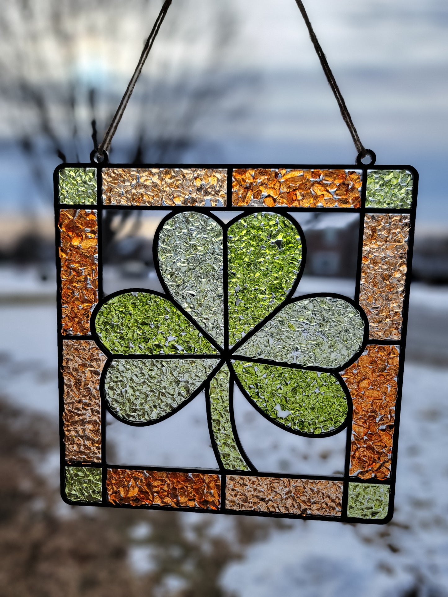 Stained glass panel with a clover design.