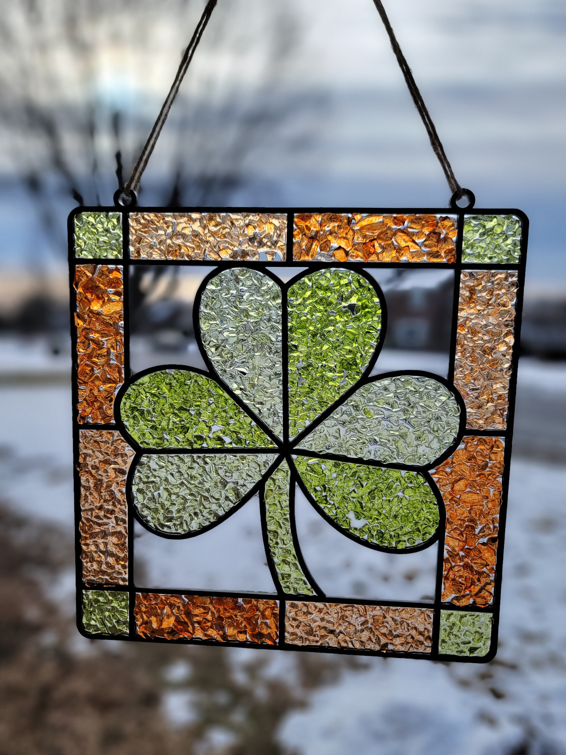 Stained glass panel with a clover design.