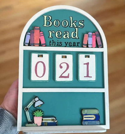 Decorative shelf with 'Books read this year' display, showing '021' on a wooden background.