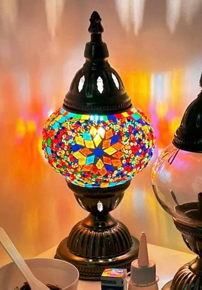 Colorful mosaic table lamp with a blurred background