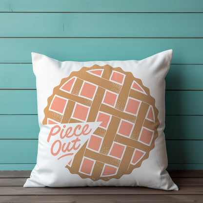 Pillow with a pie design and 'Piece Out' text against a teal wooden background