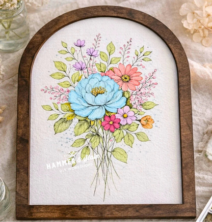 Floral illustration in a wooden frame on a textured surface