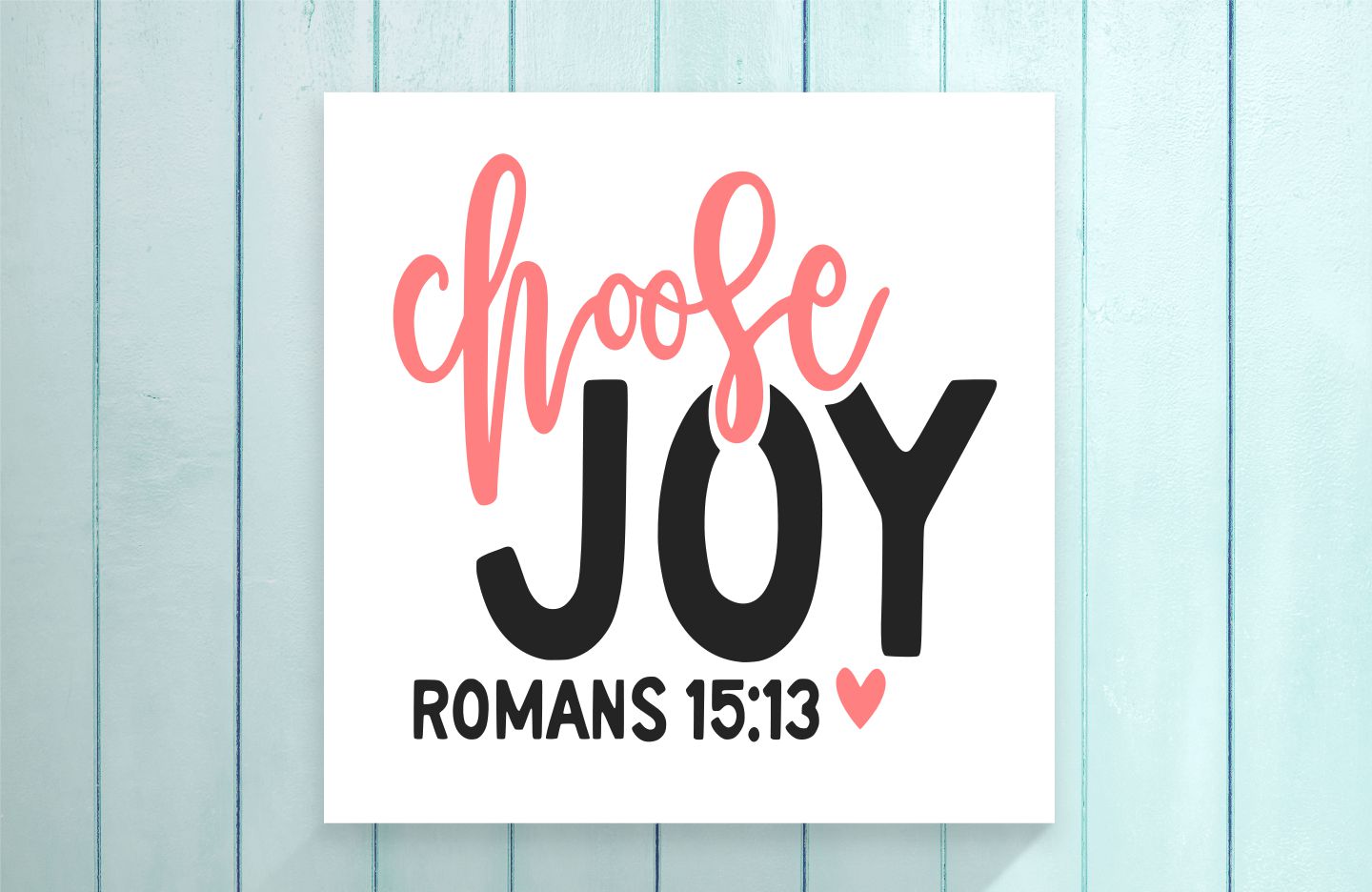 Poster with 'Choose Joy' text on a light blue wooden background
