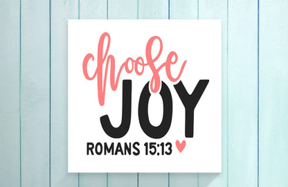 Poster with 'Choose Joy' text on a light blue wooden background