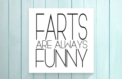 Poster with 'Farts are always funny' text on a light blue wooden background